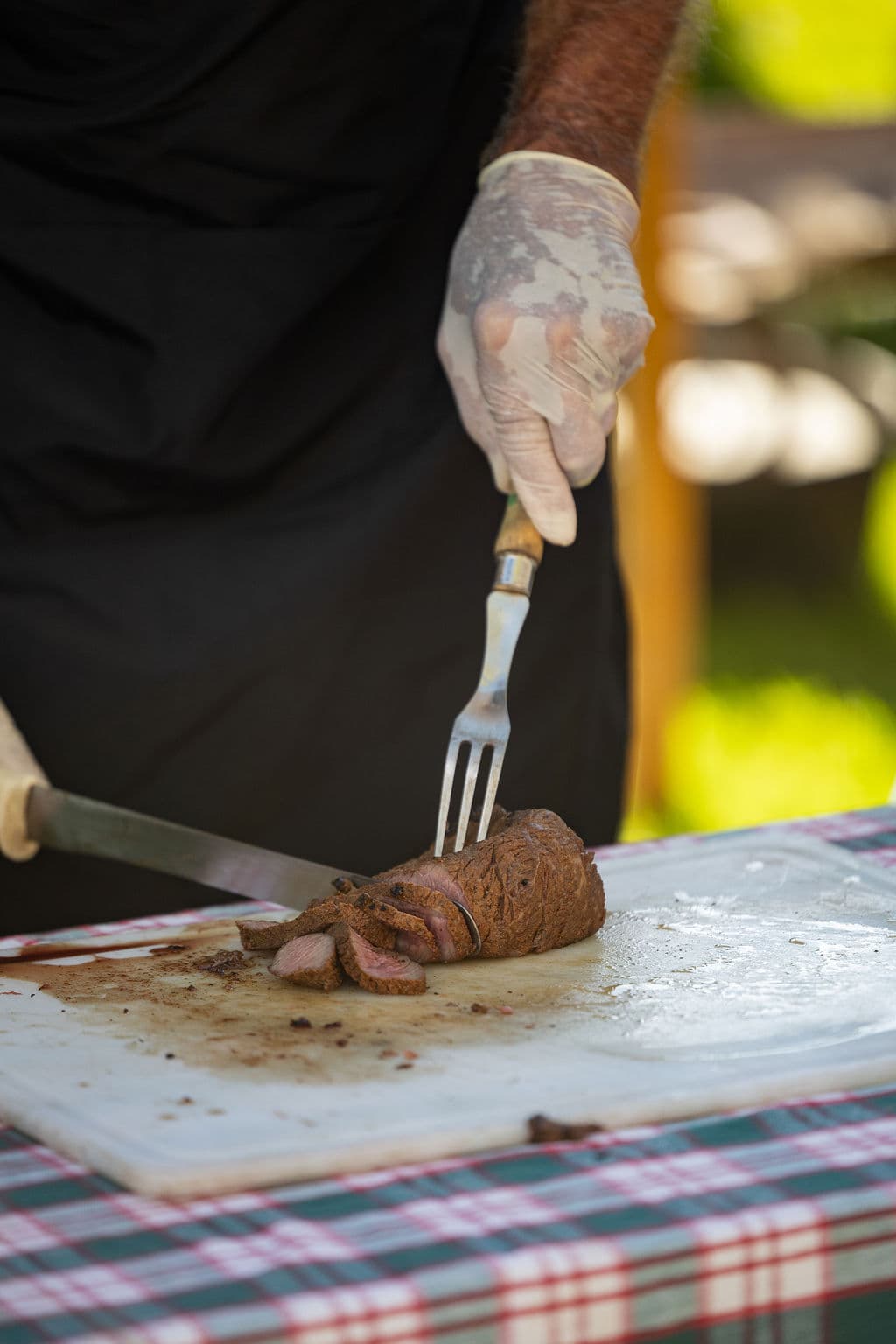 Chuckwagon cook carving roast beef