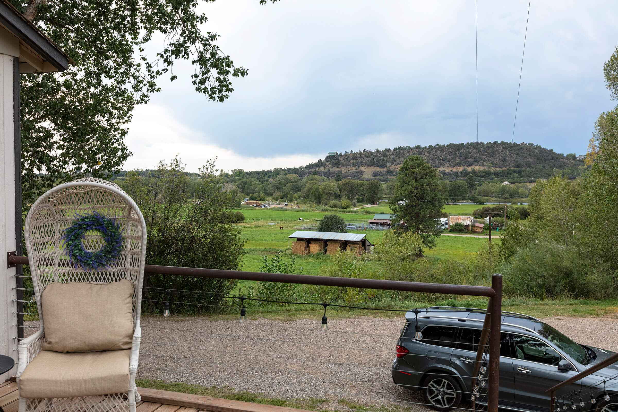 View from The Loft deck looking out over ranch pastures and mountains