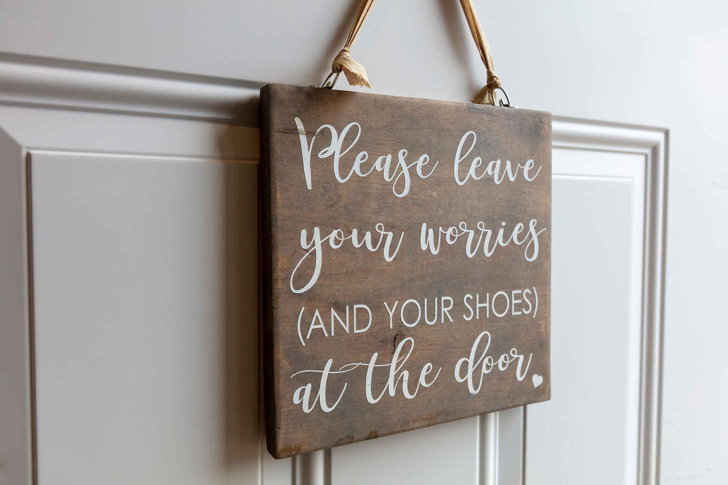 Rustic welcome sign: Please leave your worries and your shoes at the door